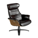 sillón lounge giratorio con función reclinable, tapizado en piel negra y base de metal pintado en gris oscuro