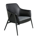 sillón minimalista con estructura metálica negra, respaldo tapizado y asiento en tela gris oscuro