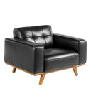 sillón de estilo clásico contemporáneo en piel negra con patas inclinadas de madera y asiento amplio


