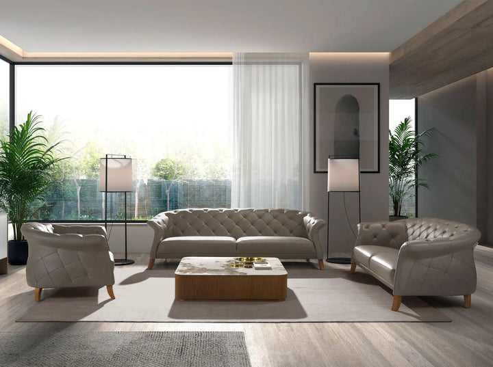 sofá clásico estilo chester en tono gris con diseño acolchado y patas de madera