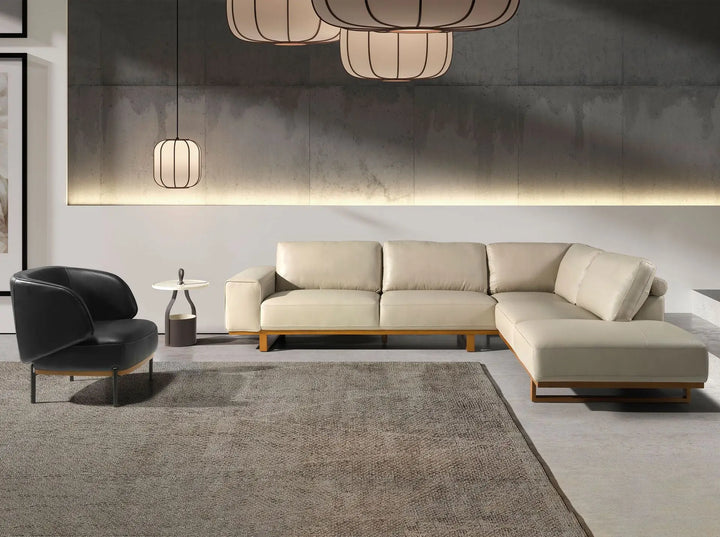 sofa rinconero moderno de polipiel beige con patas de madera minimalista